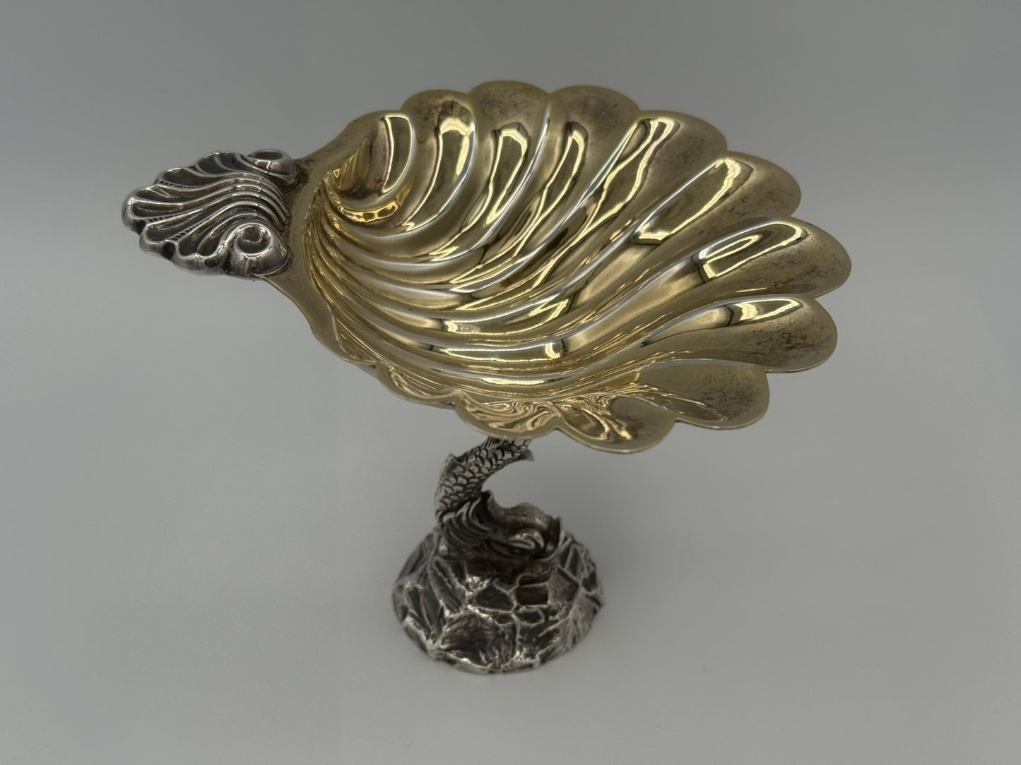 Fine Antique English Silver Master Salt Cellar w/ a dolphin-shaped base and a shell-shaped bowl