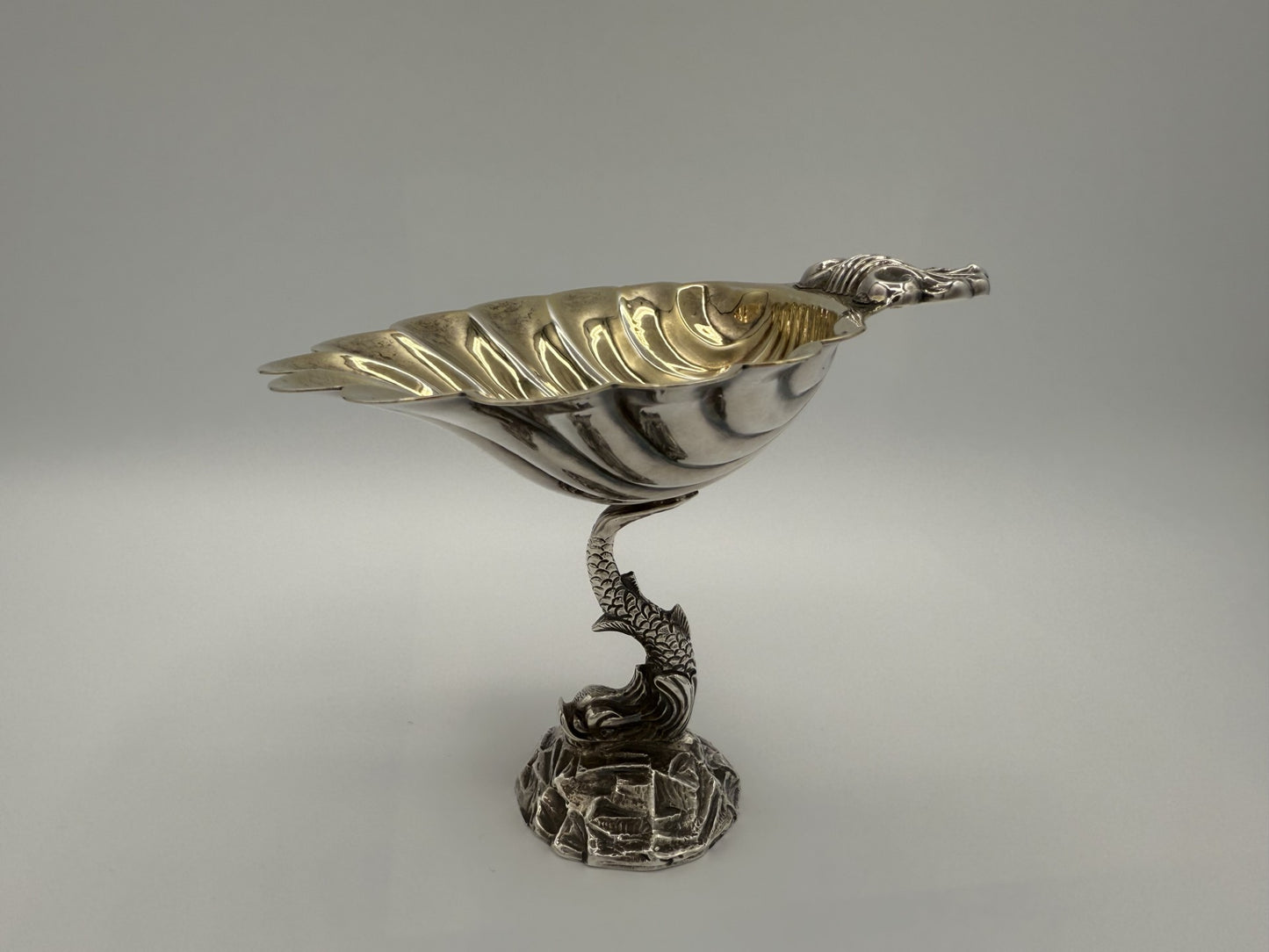 Fine Antique English Silver Master Salt Cellar w/ a dolphin-shaped base and a shell-shaped bowl